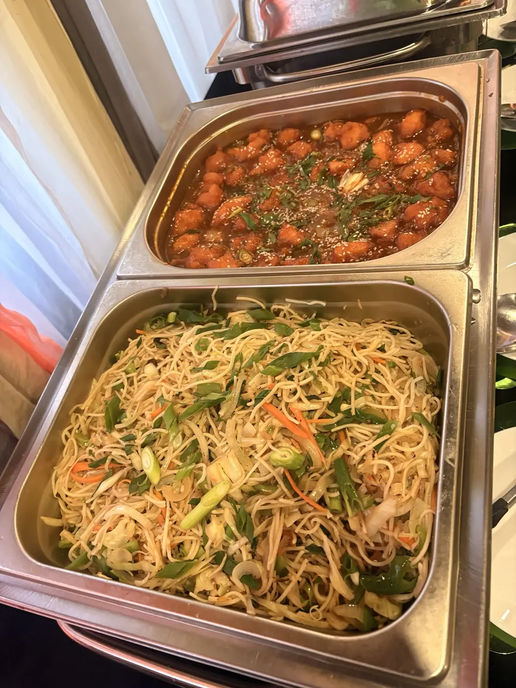 Hakka noodles and a saucy Indo-Chinese dish served buffet-style at Aura Indian Cuisine