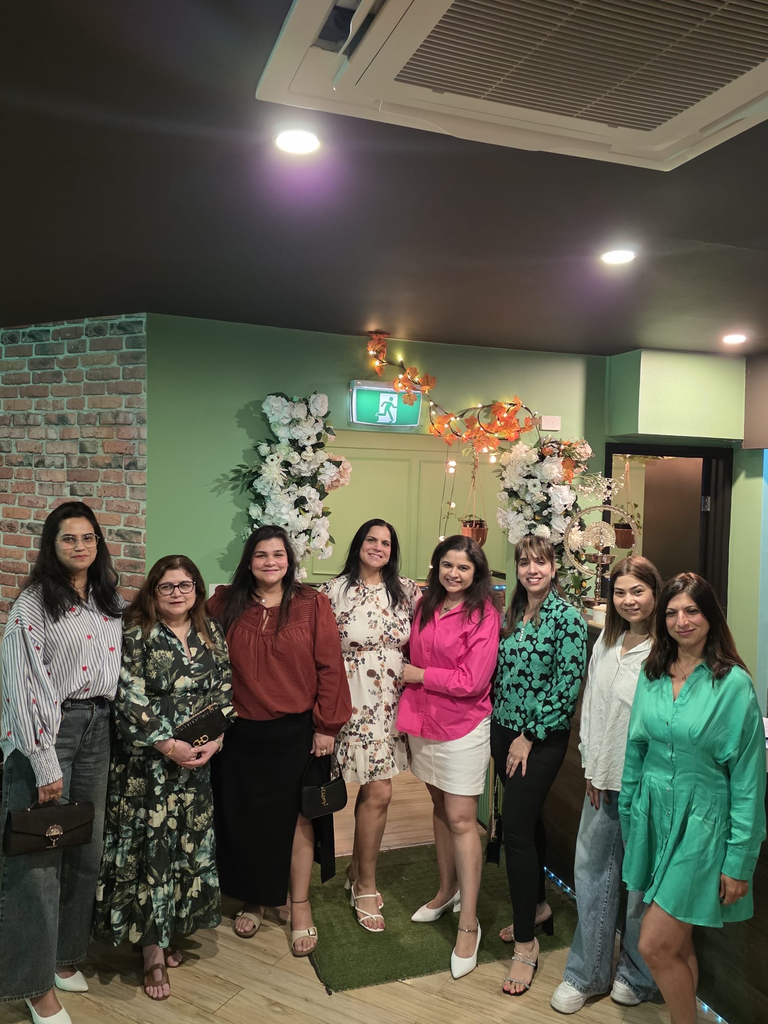 A group of guests gathered for a celebration inside Aura Indian Cuisine